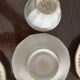 a vintage coffee or tea set in white porcelain with patterns and