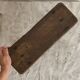 Old low stool made of solid wood