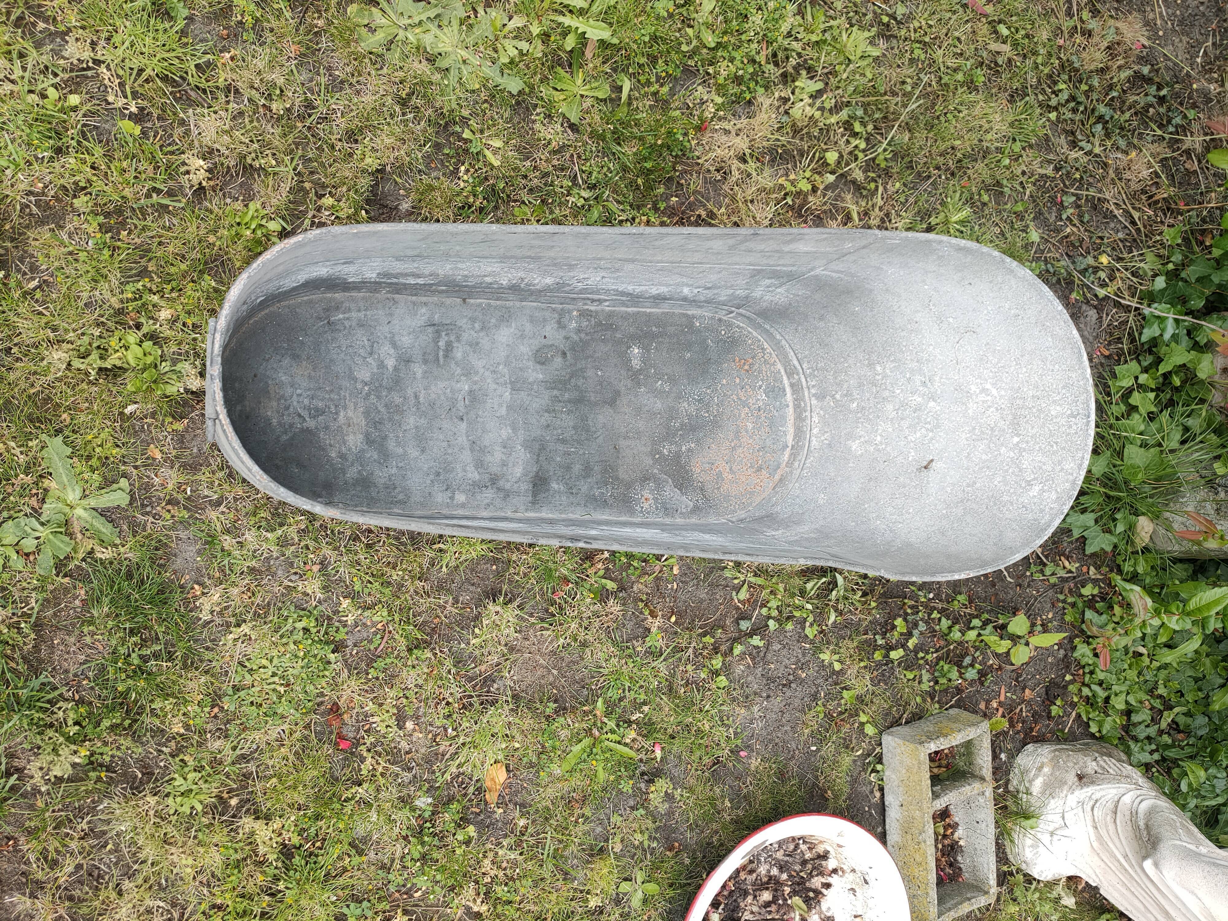 Antique children's bathtub in zinc