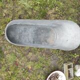 Antique children's bathtub in zinc