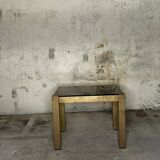Trio of nesting tables, brass structures and smoked mirror tops