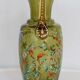 Enamelled green glass vase