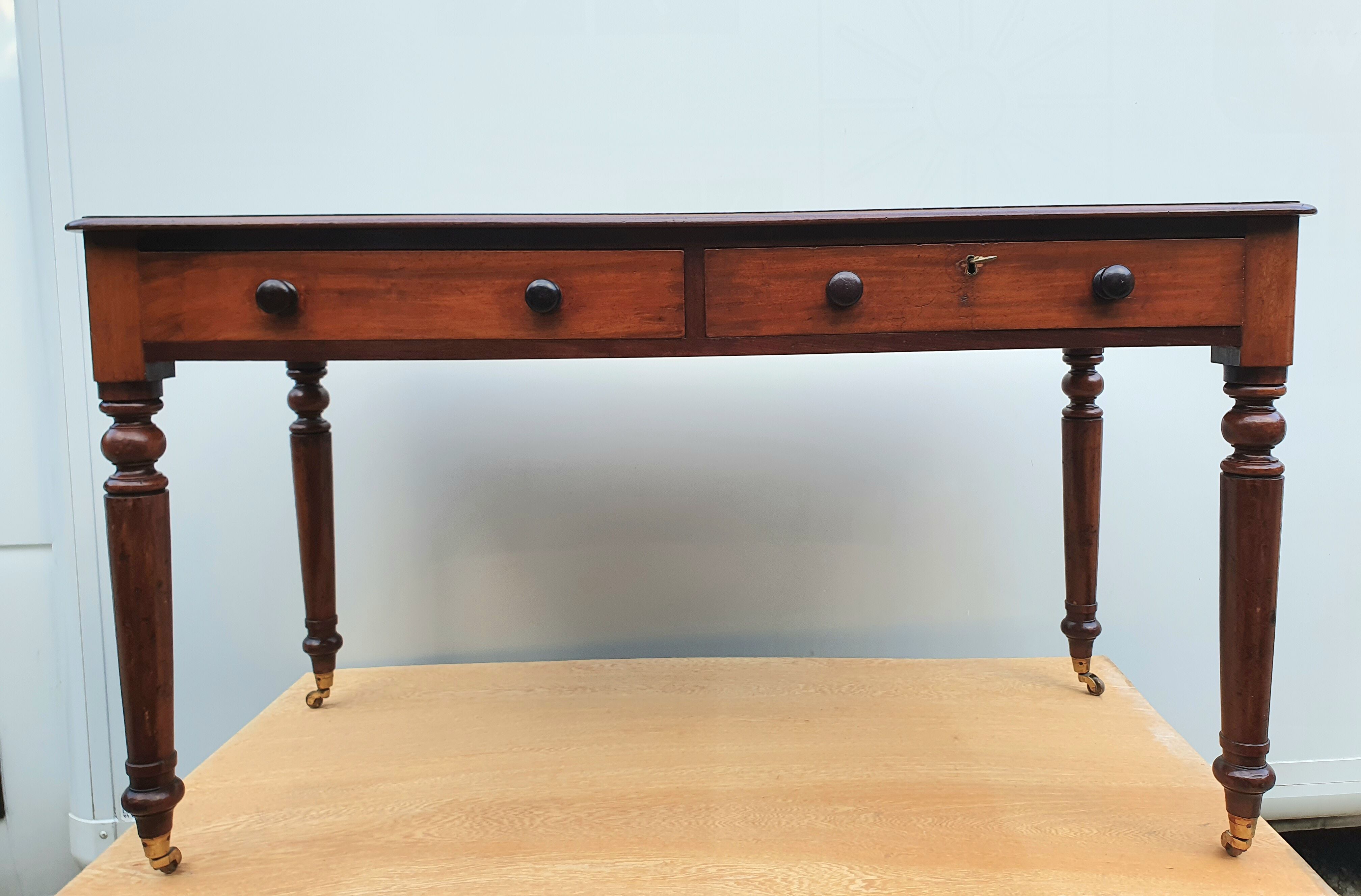 English desk with 2 drawers on green leather