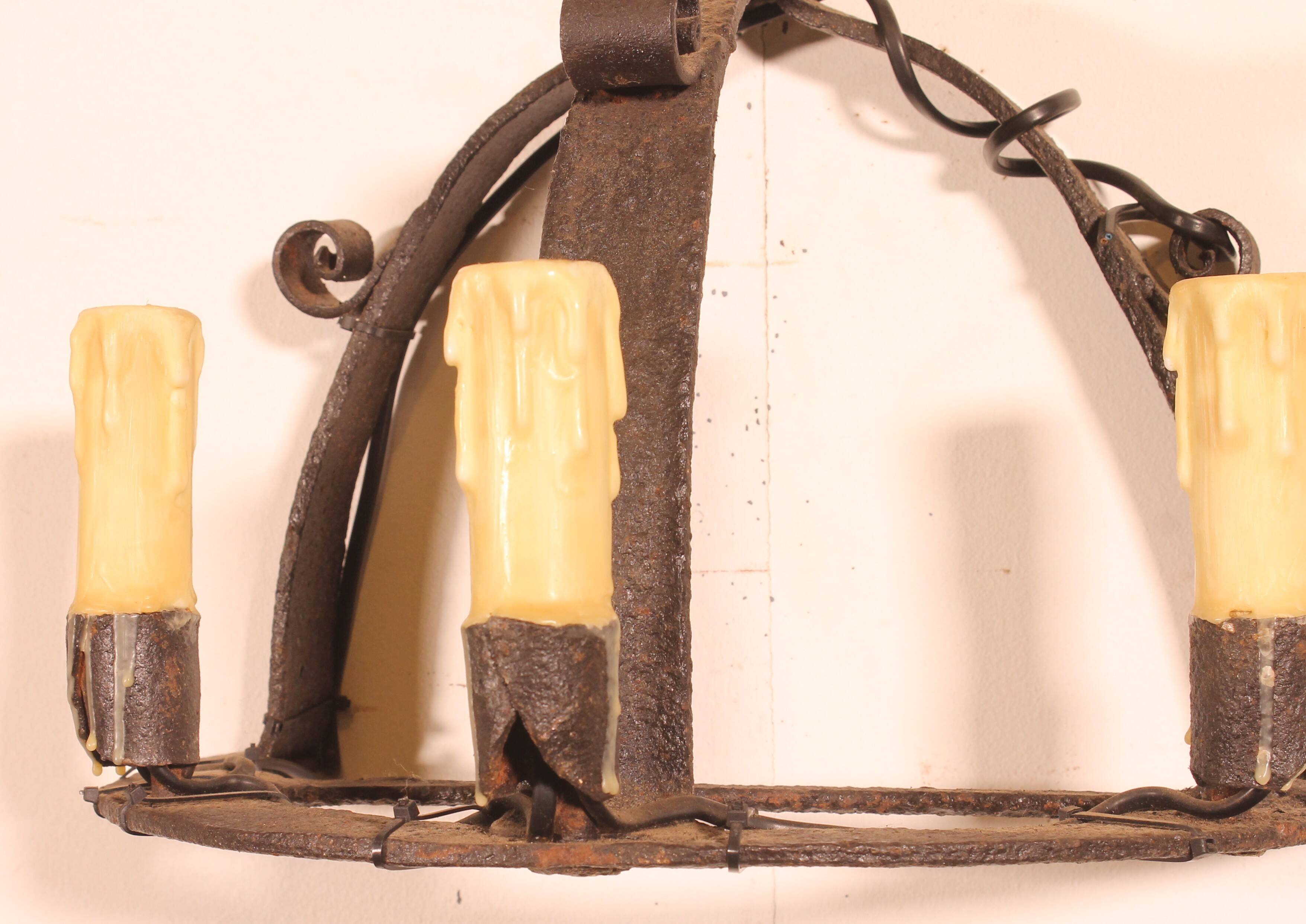 Pair of wrought iron wall sconces in medieval style