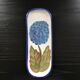 Hortensia-decorated stoneware plate signed