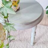 Antique tripod stool made of solid wood in blue.