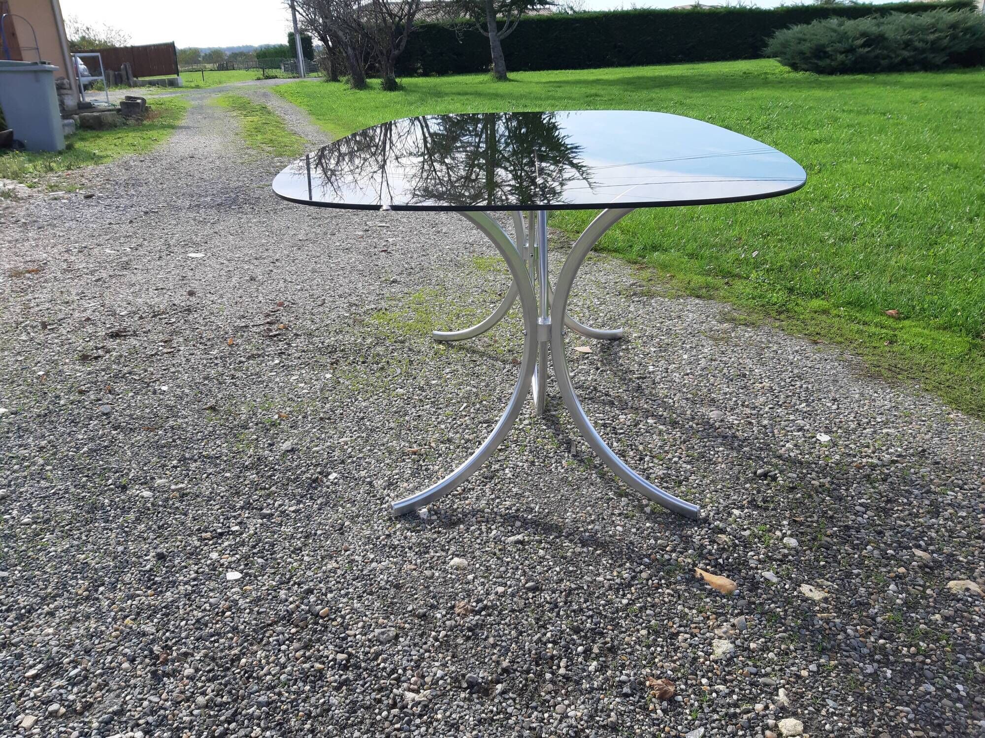 Vintage table of the 70s in chrome and smoked glass