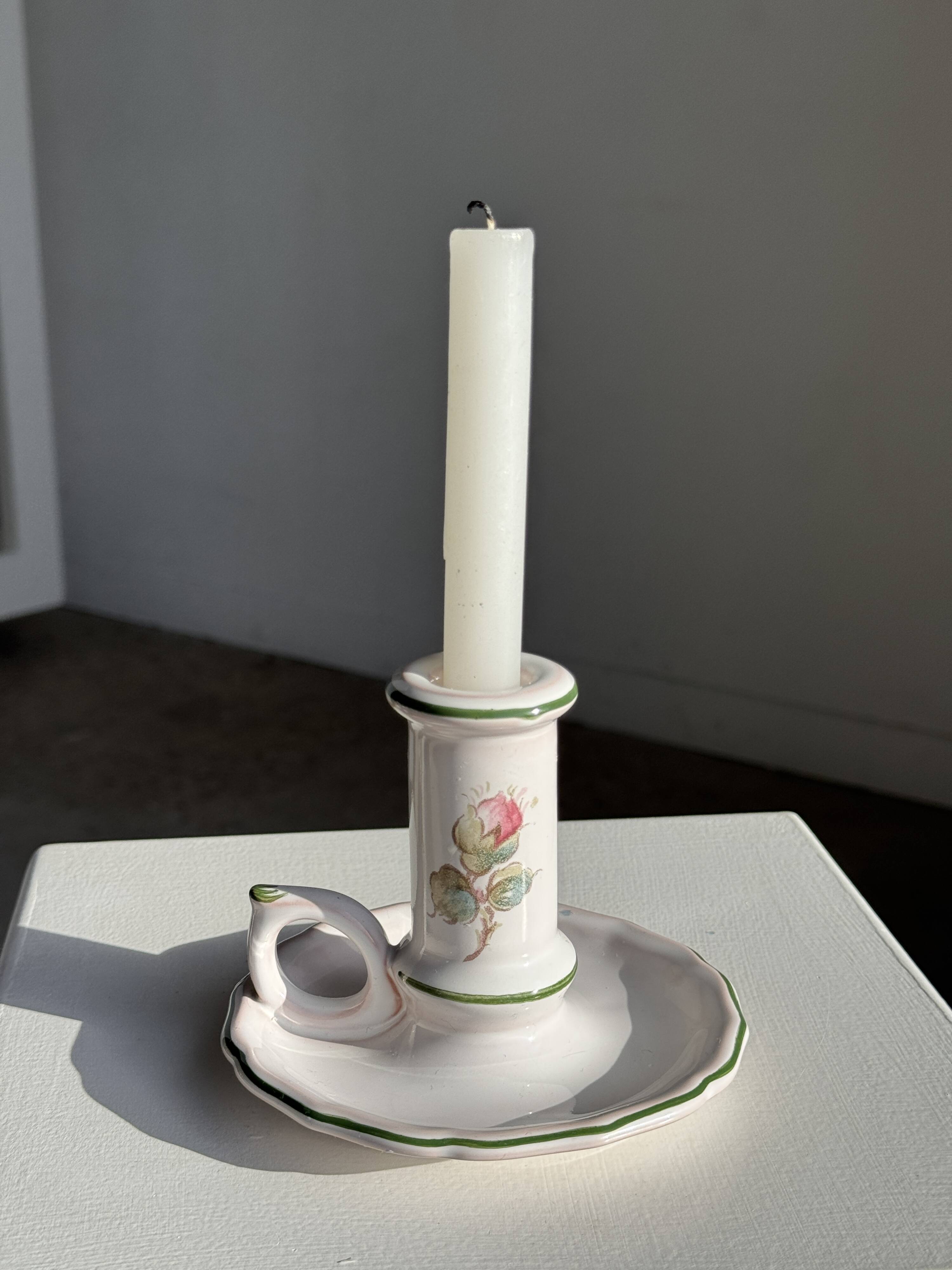 Small vintage hand-held candlestick in earthenware with green trim and floral decoration H10.5