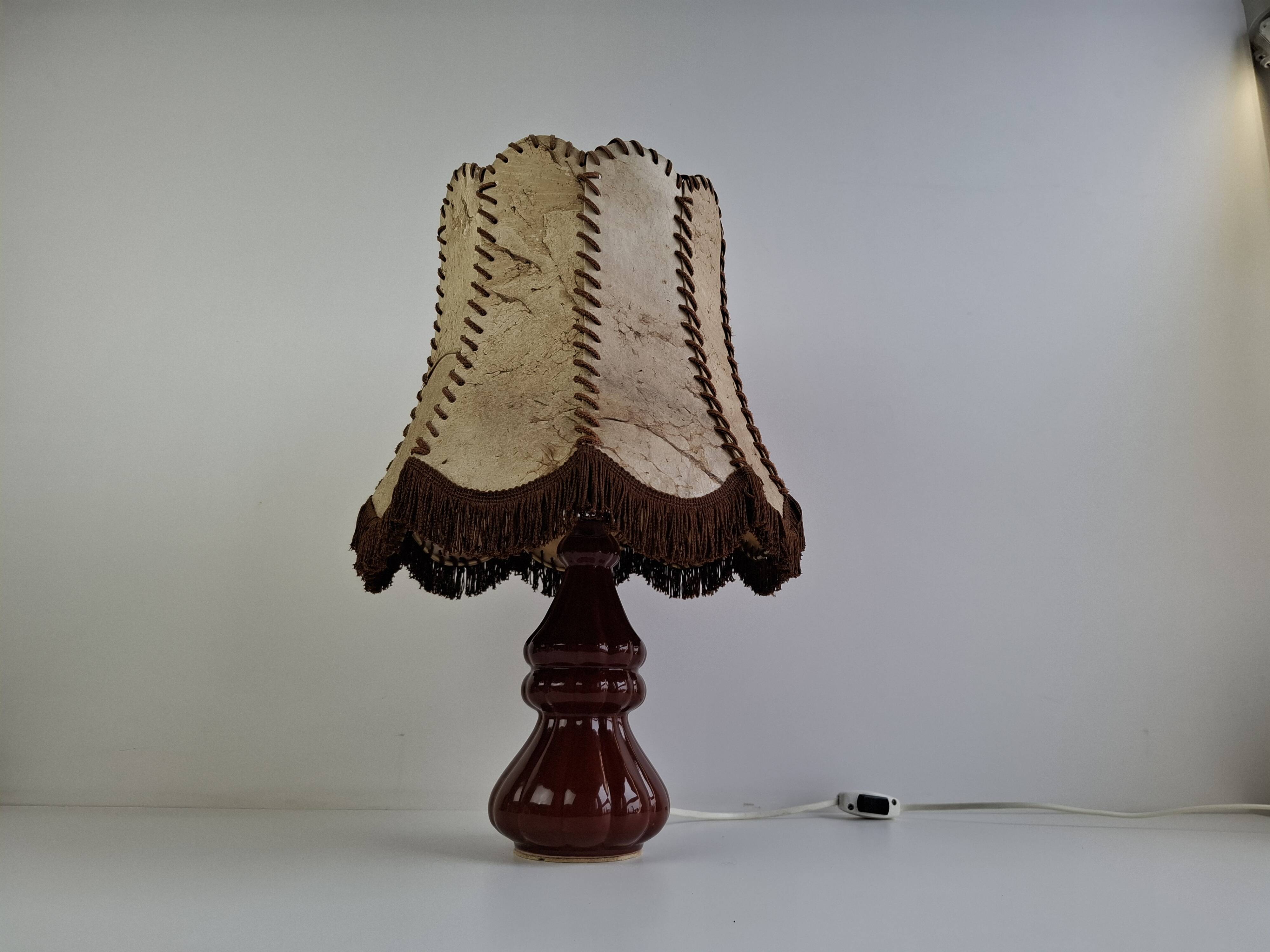Vintage ceramic table lamp with hand-stitched leather shade, 1980s.