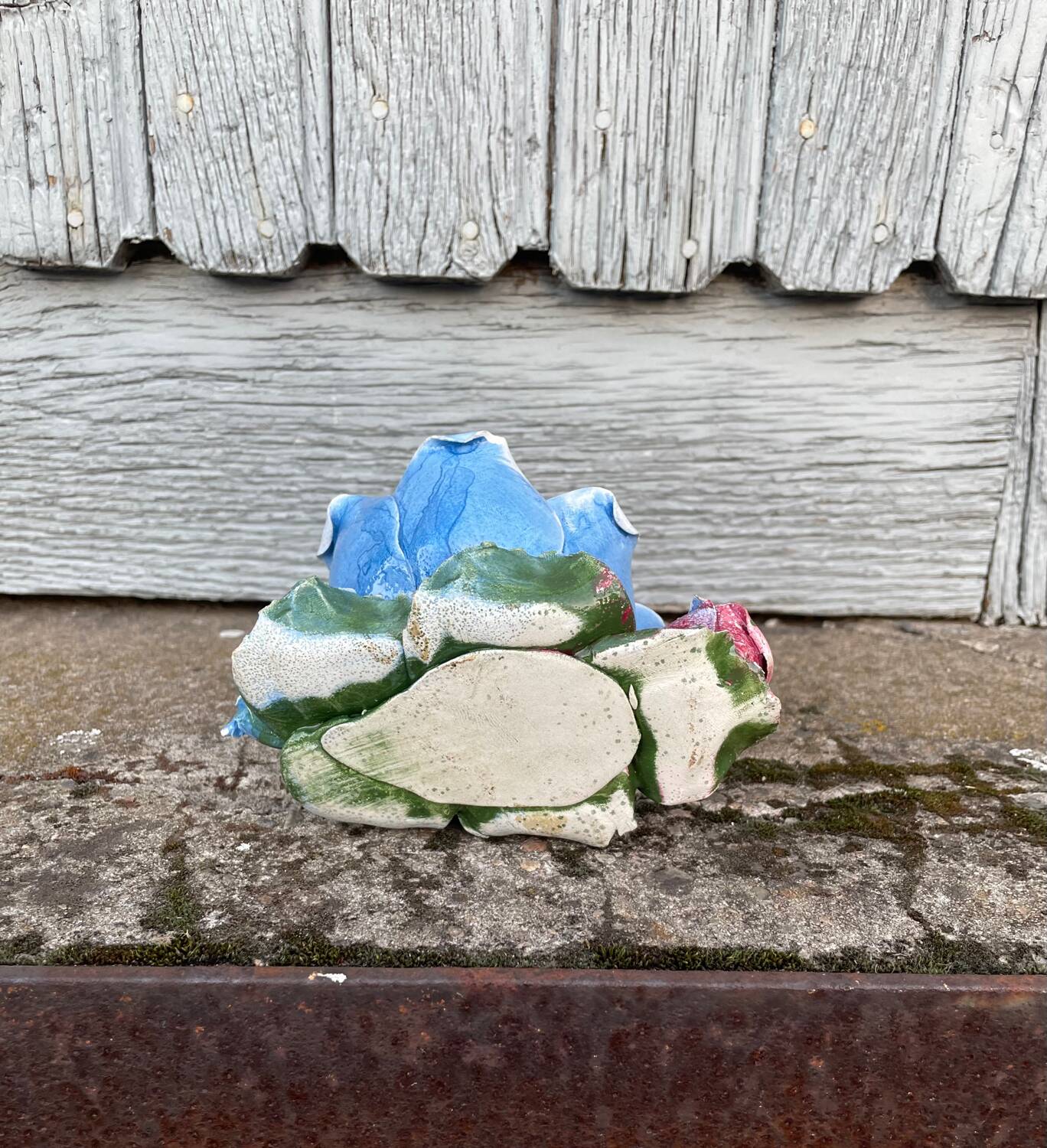 Old barbotine candle holder in the shape of a rose