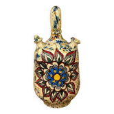polychrome floral-decorated jug in glazed ceramic