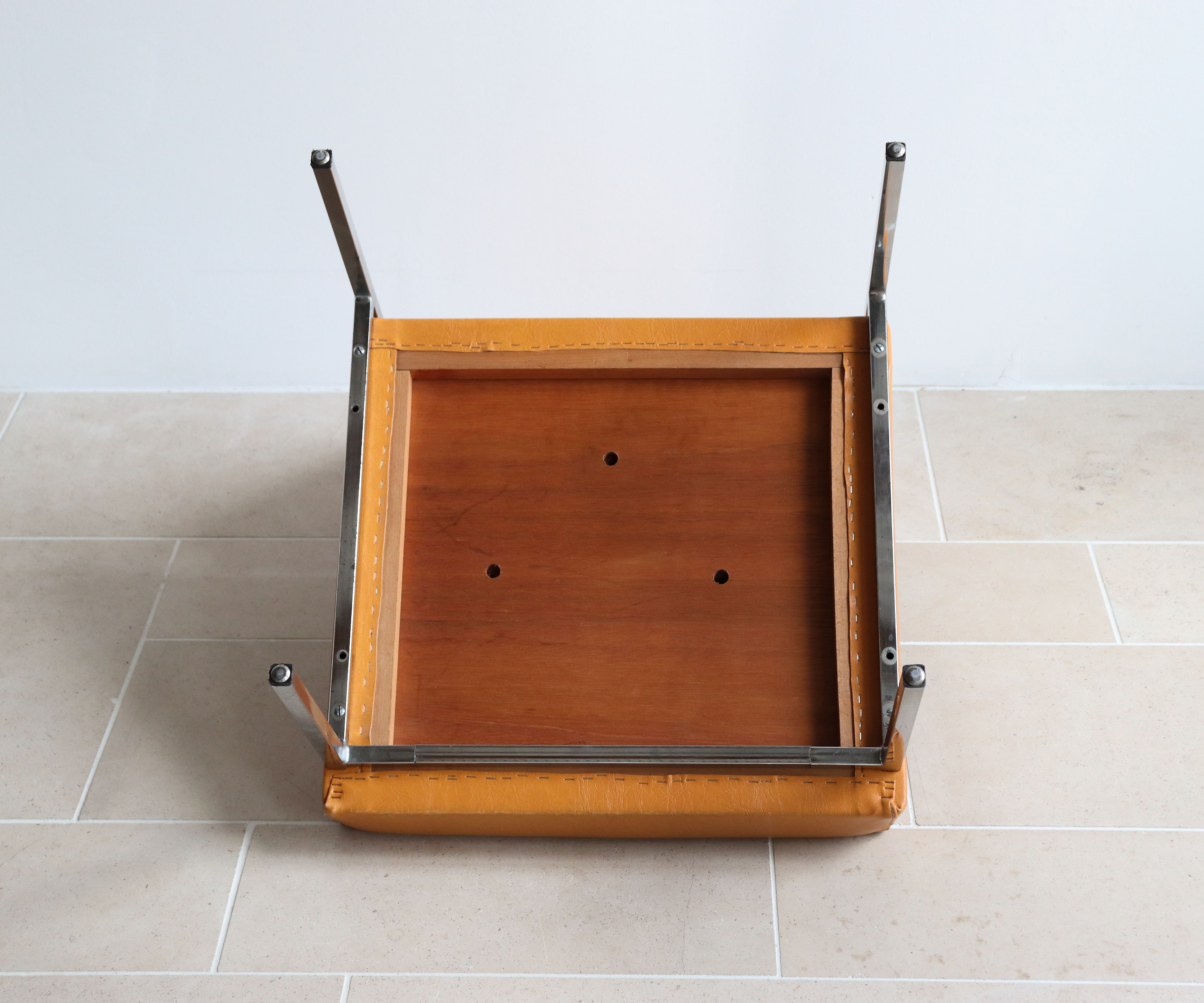 Modernist armchair in chromed metal and imitation leather, 50s/60s