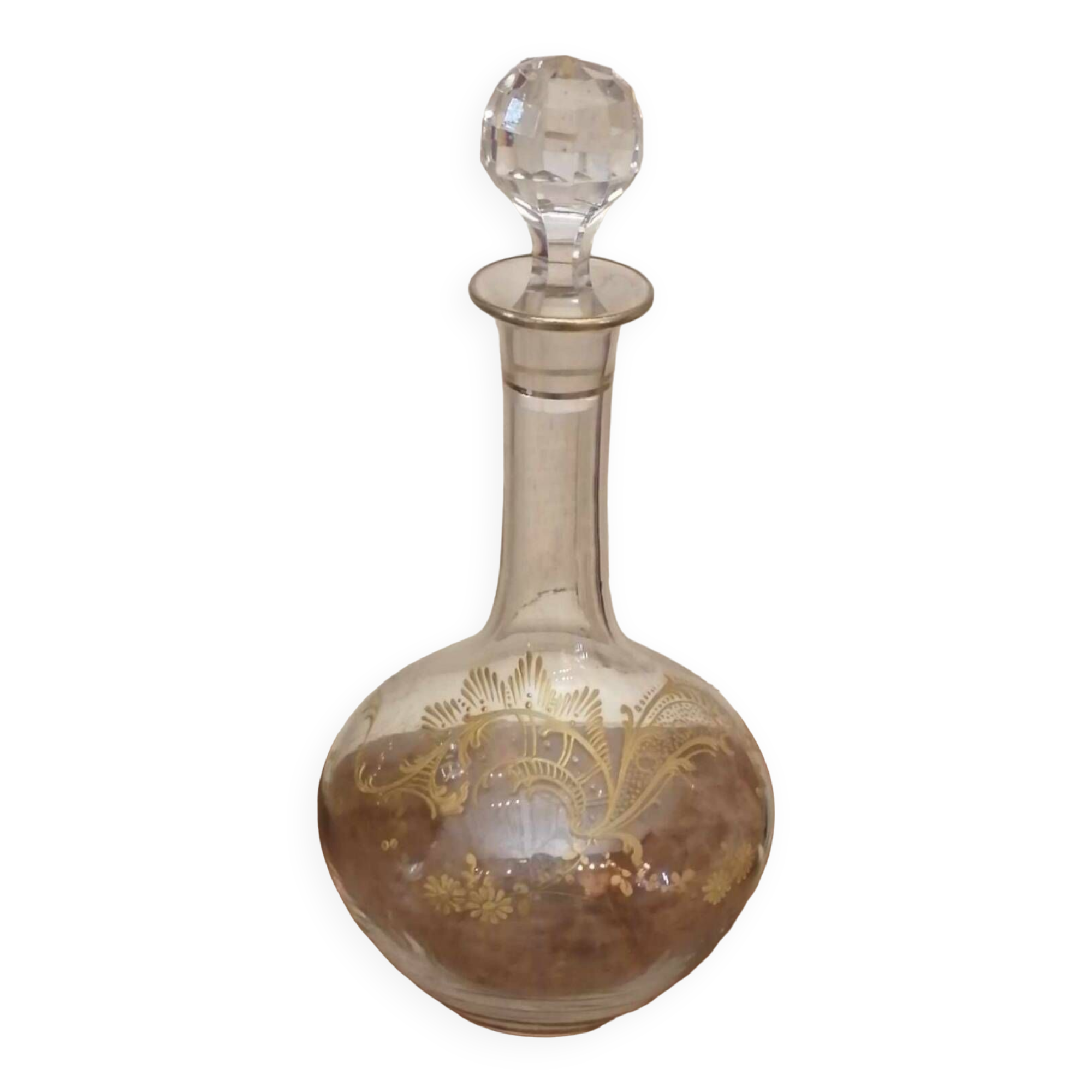 Old crystal decanter with gold decoration