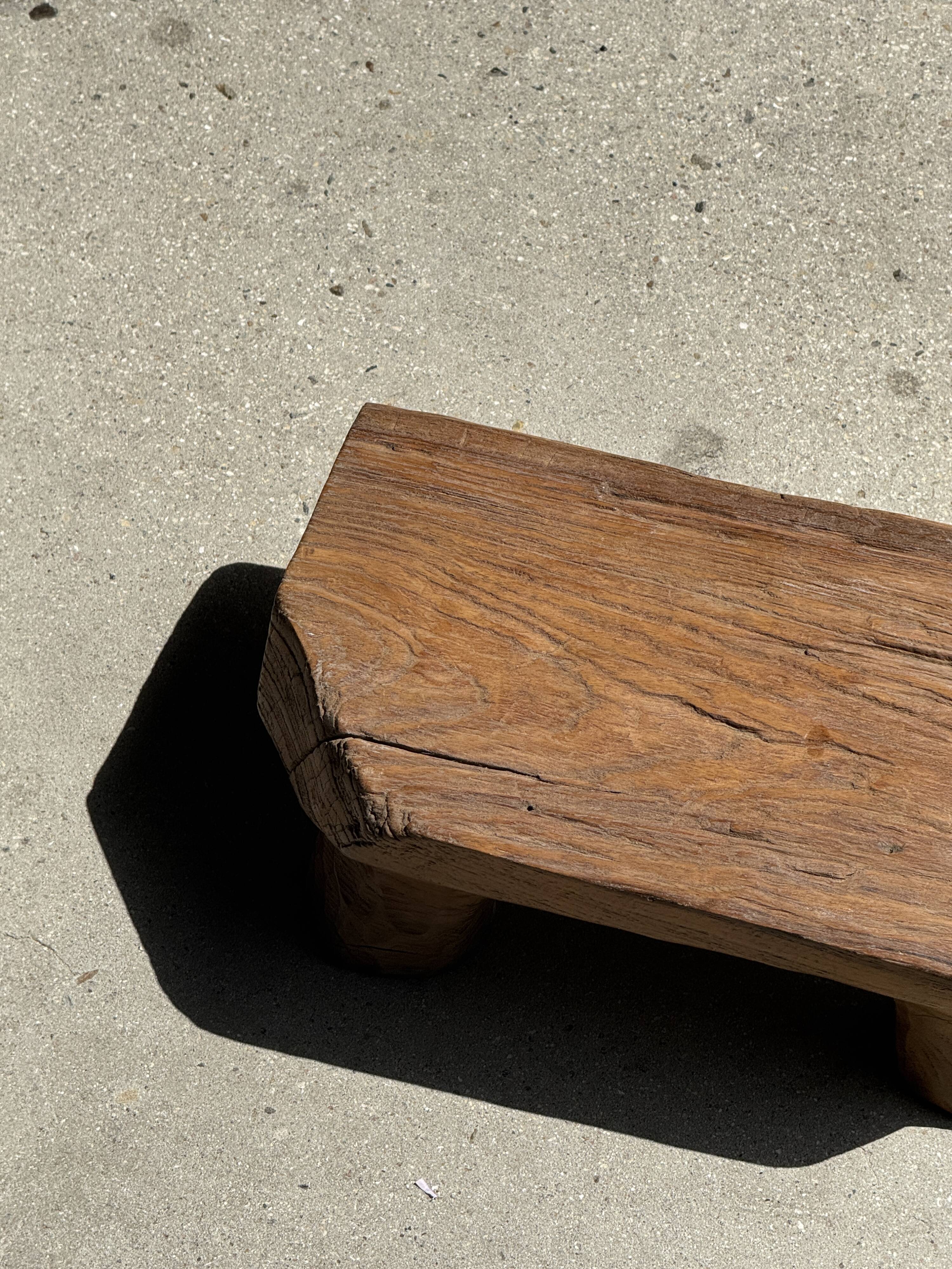 Small stool, teak footrest with short cut corners.