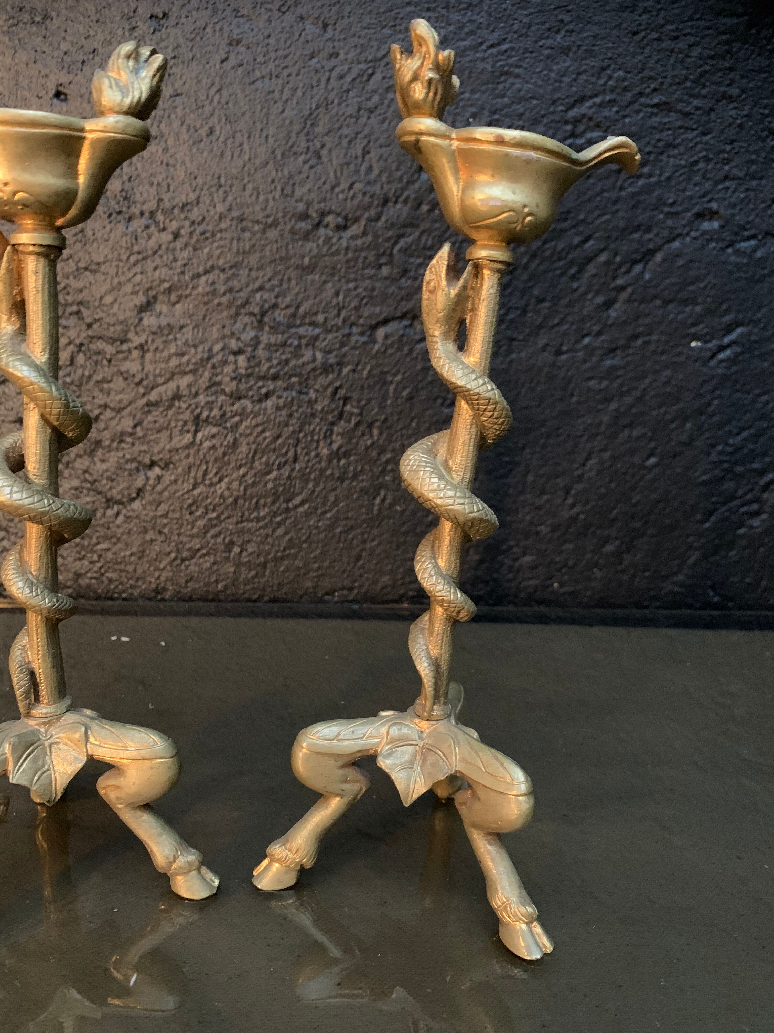 Pair of candlesticks with snakes, gilded bronze 19th century