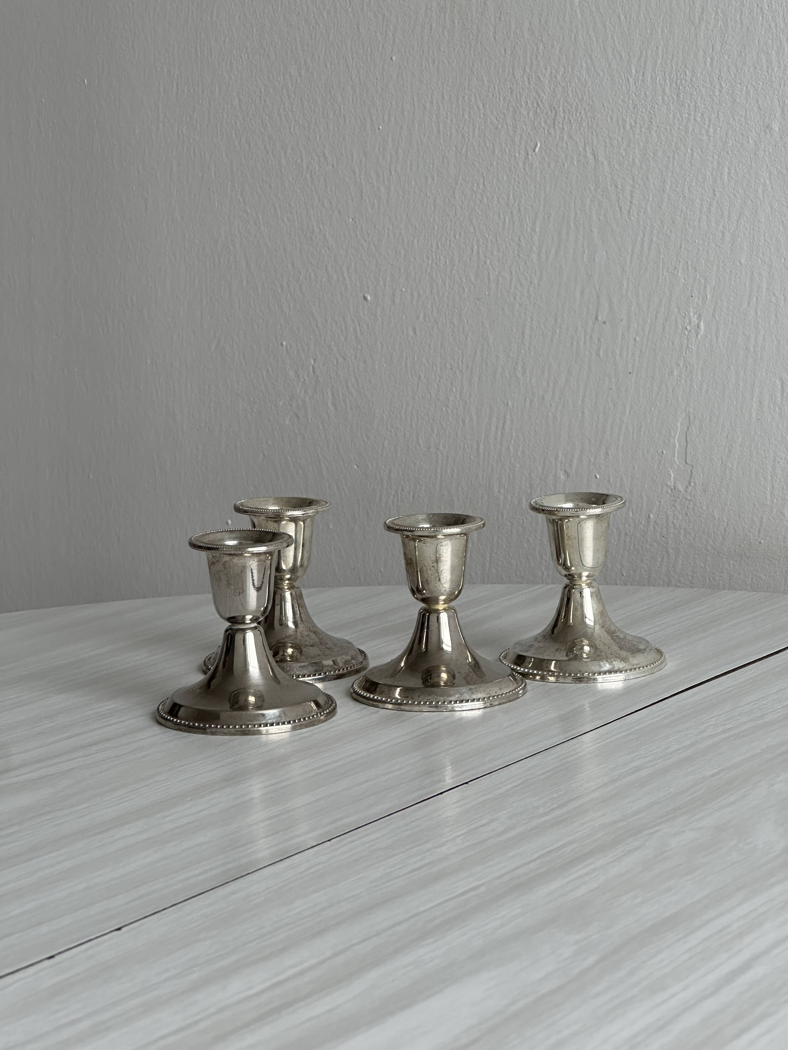 4 vintage metal candle holders