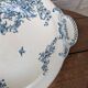 Shallow round plate Boch Frères model Regent with arabesque and foliage decoration.