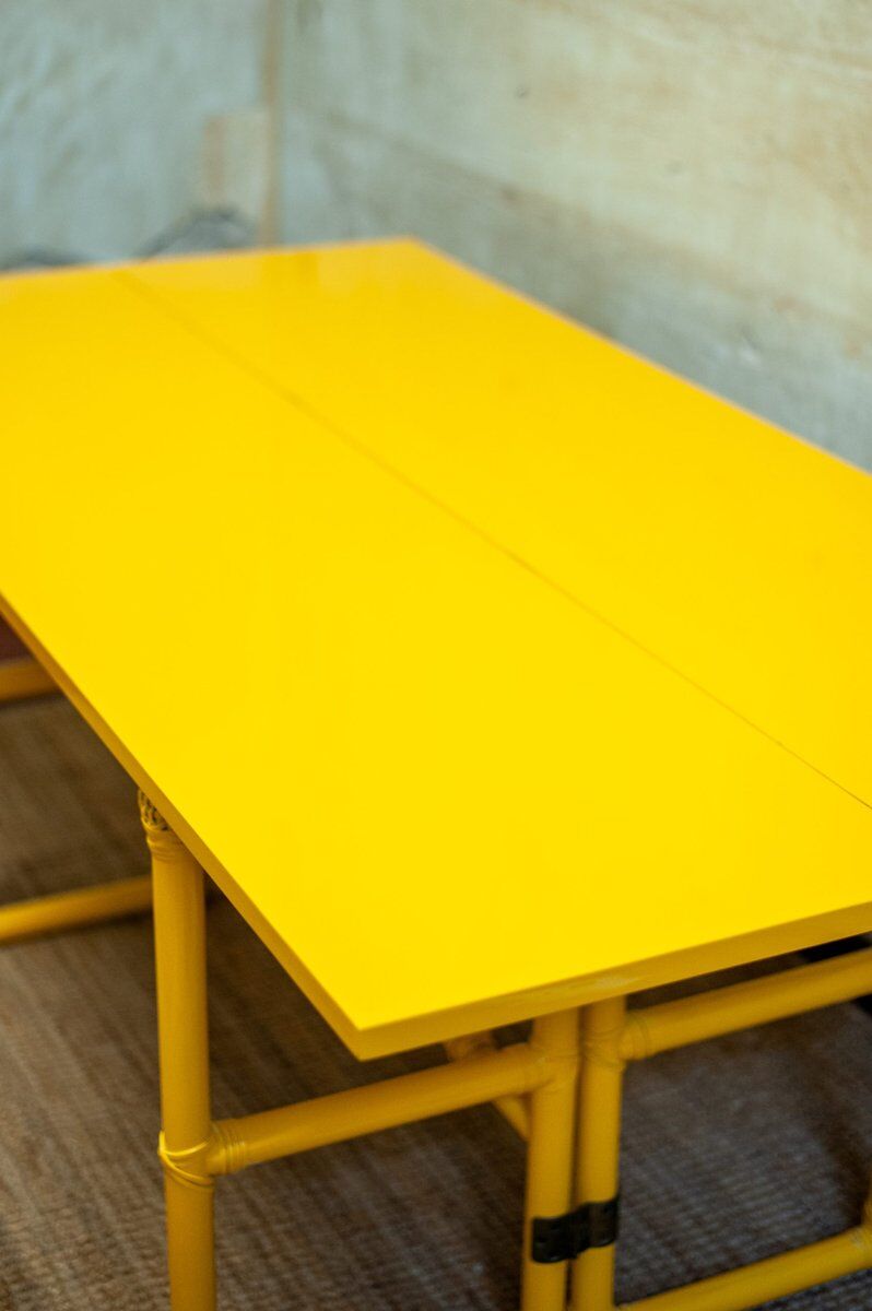 Yellow lacquered console with a flip-top surface by McGuire San Francisco, 1970s.