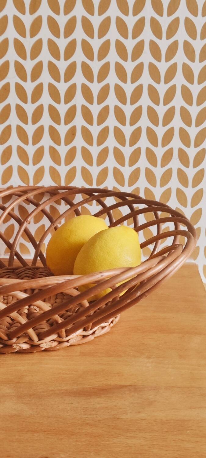 Vintage woven wicker round basket for fruits or bread.
