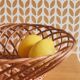 Vintage woven wicker round basket for fruits or bread.