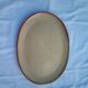 Oval dish in speckled enamelled stoneware