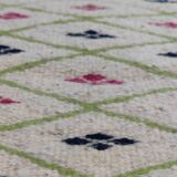 Handmade geometric patterned rug in natural wool