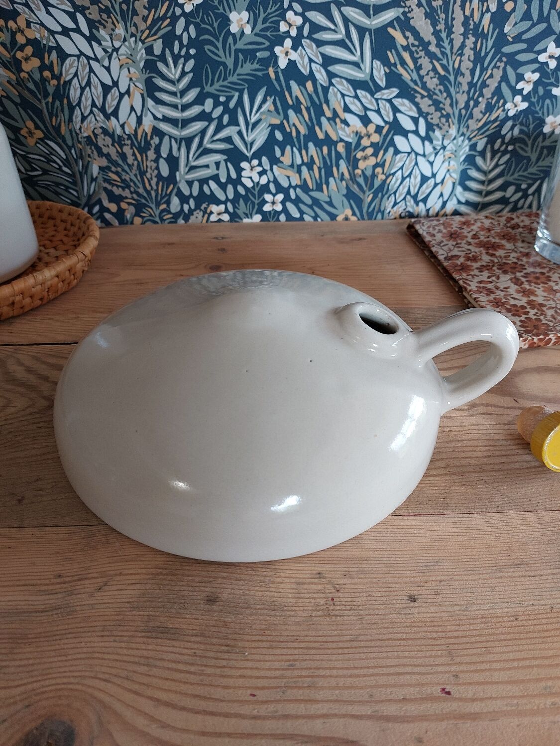 Vintage white enamelled stoneware bottle