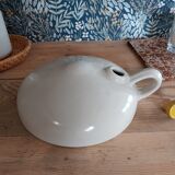 Vintage white enamelled stoneware bottle