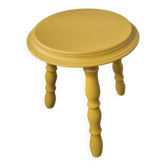 vintage yellow tripod stool with twisted legs