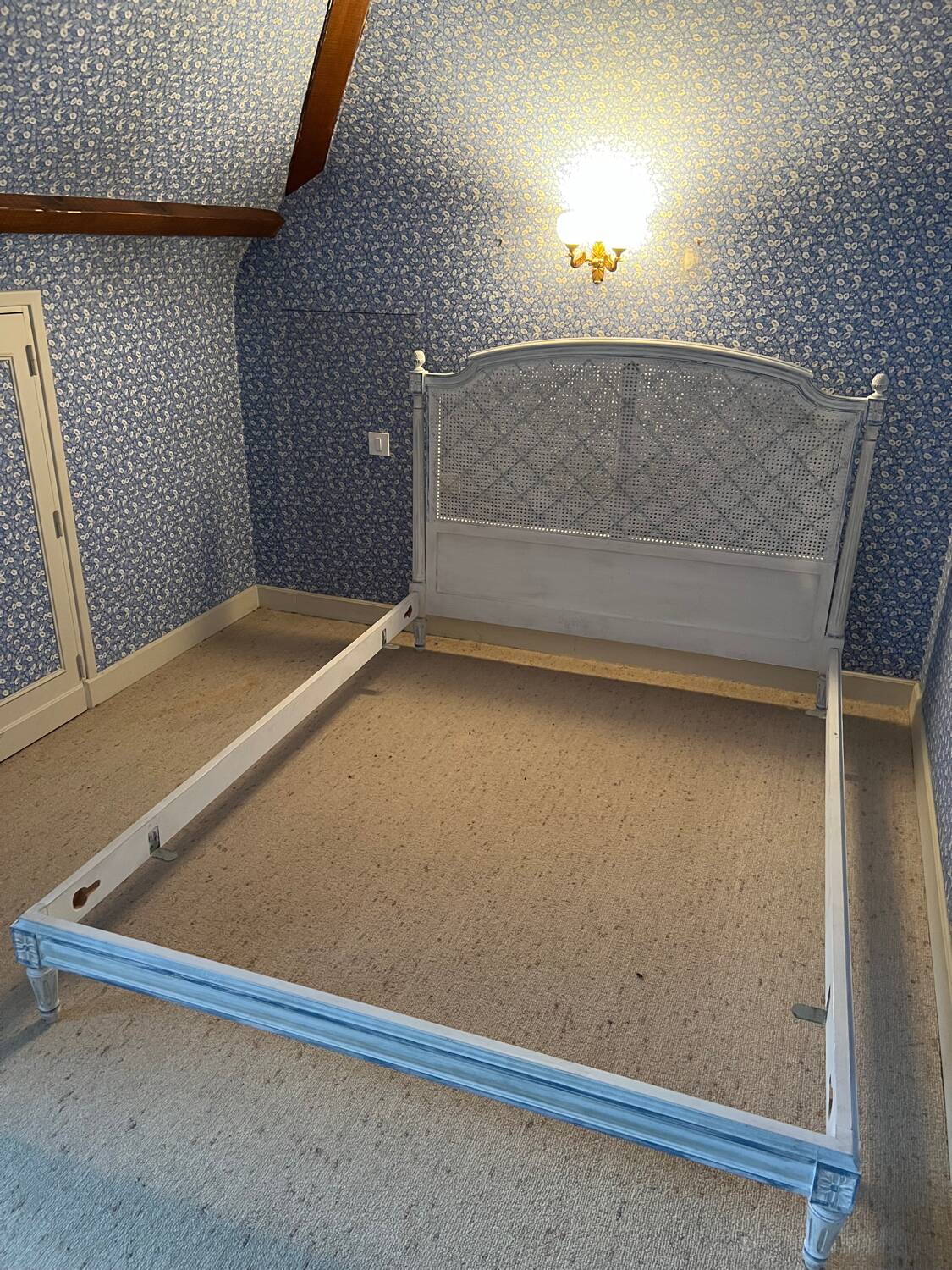 White wooden cane bed
