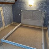 White wooden cane bed
