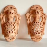 Pair of terracotta wall candle holders