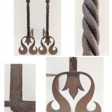 Pair of sculptural cast iron chenets with twisted heads