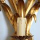 Applies "wheat sheaf" gold metal