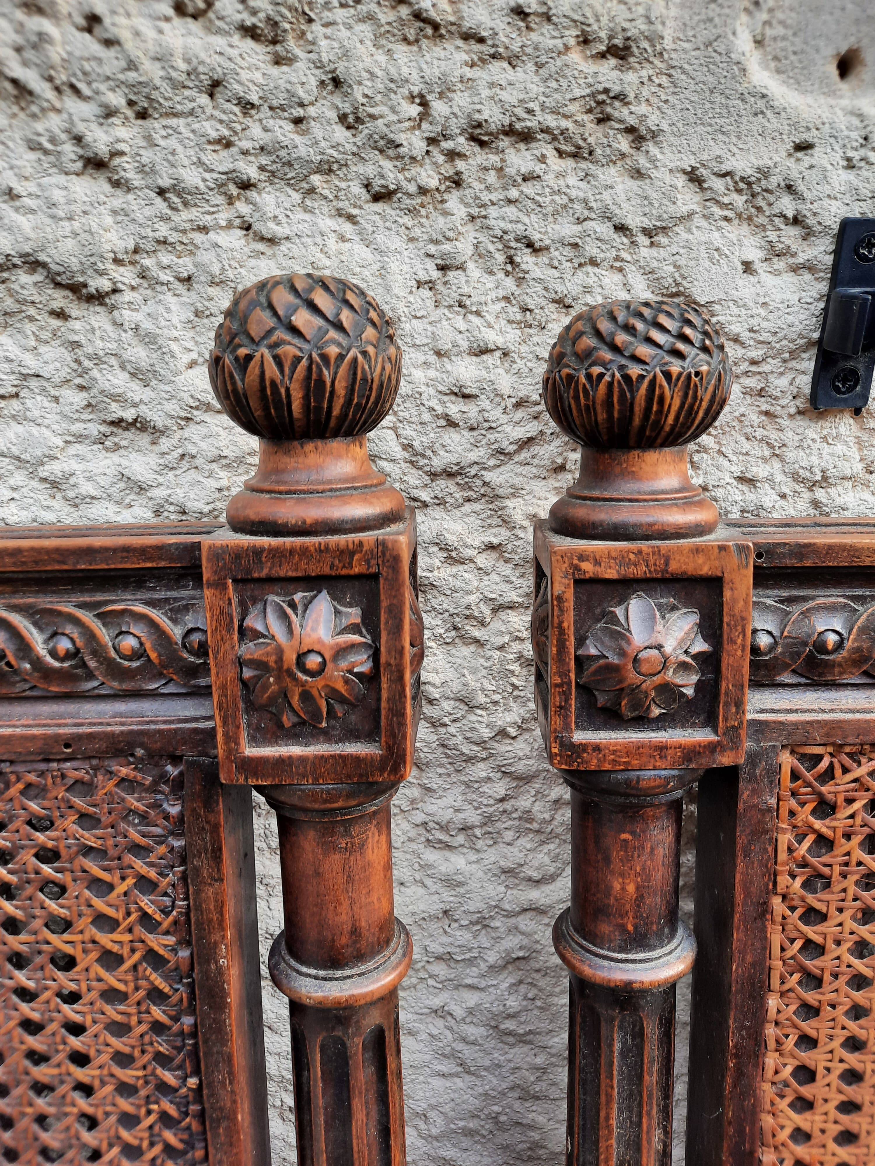 Hand-carved Louis XVI style headboards with chic vintage caning (1800s)