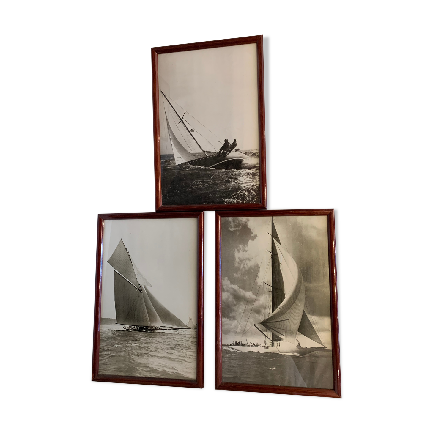 Three black and white-themed photographs sailboat boat with mahogany frame