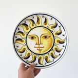 Decorative ceramic plate with sun face