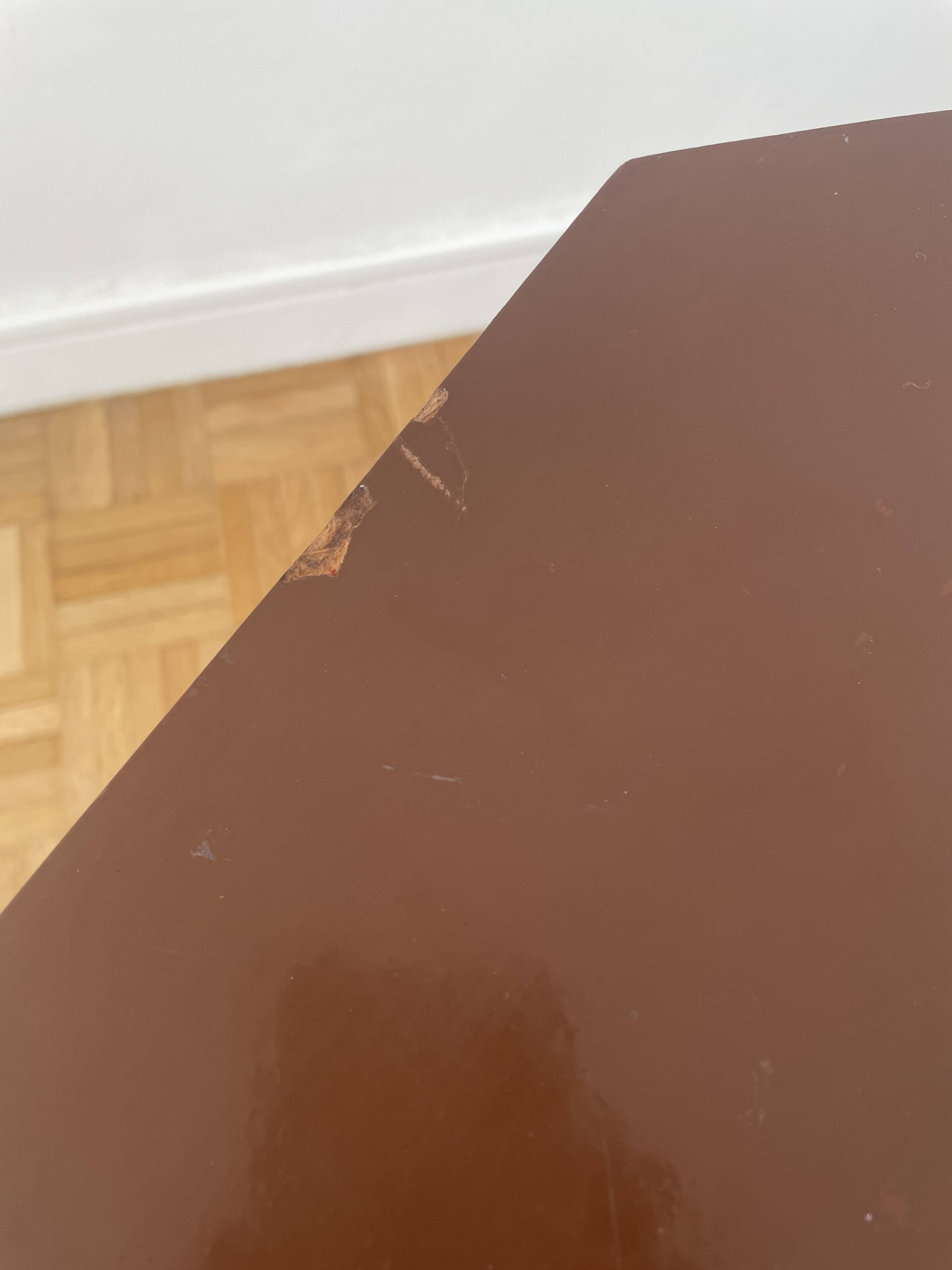 Brown coffee table with tapered legs.