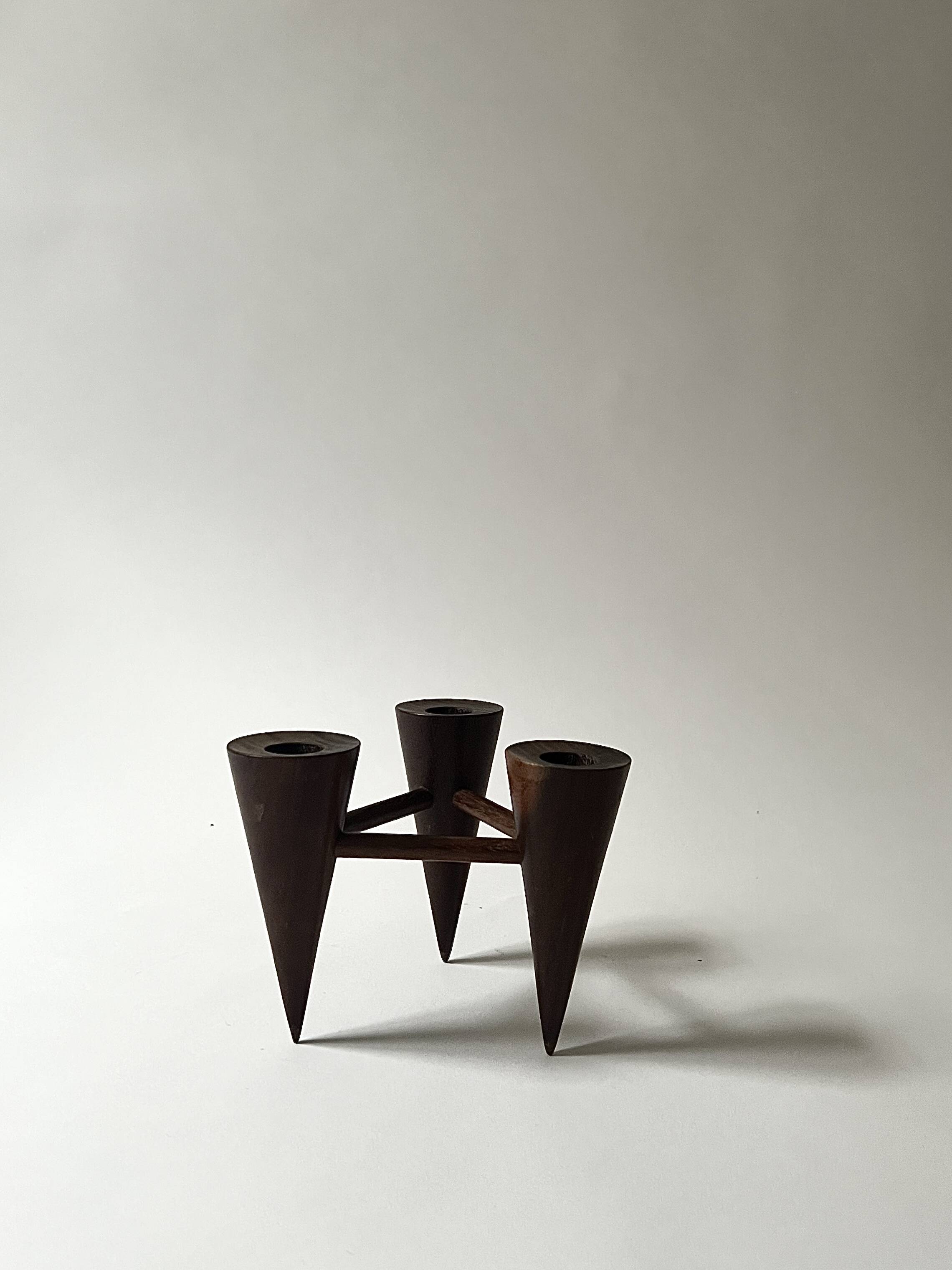 Scandinavian tripod candle holder in carved wood, design from around 1970.