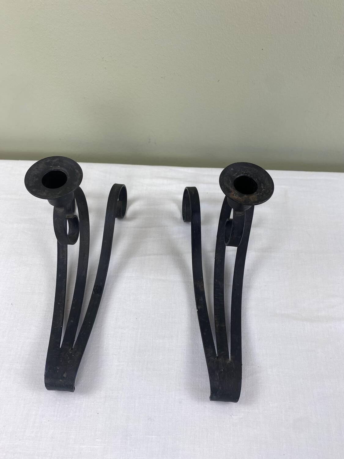 Pair of wrought iron candlesticks