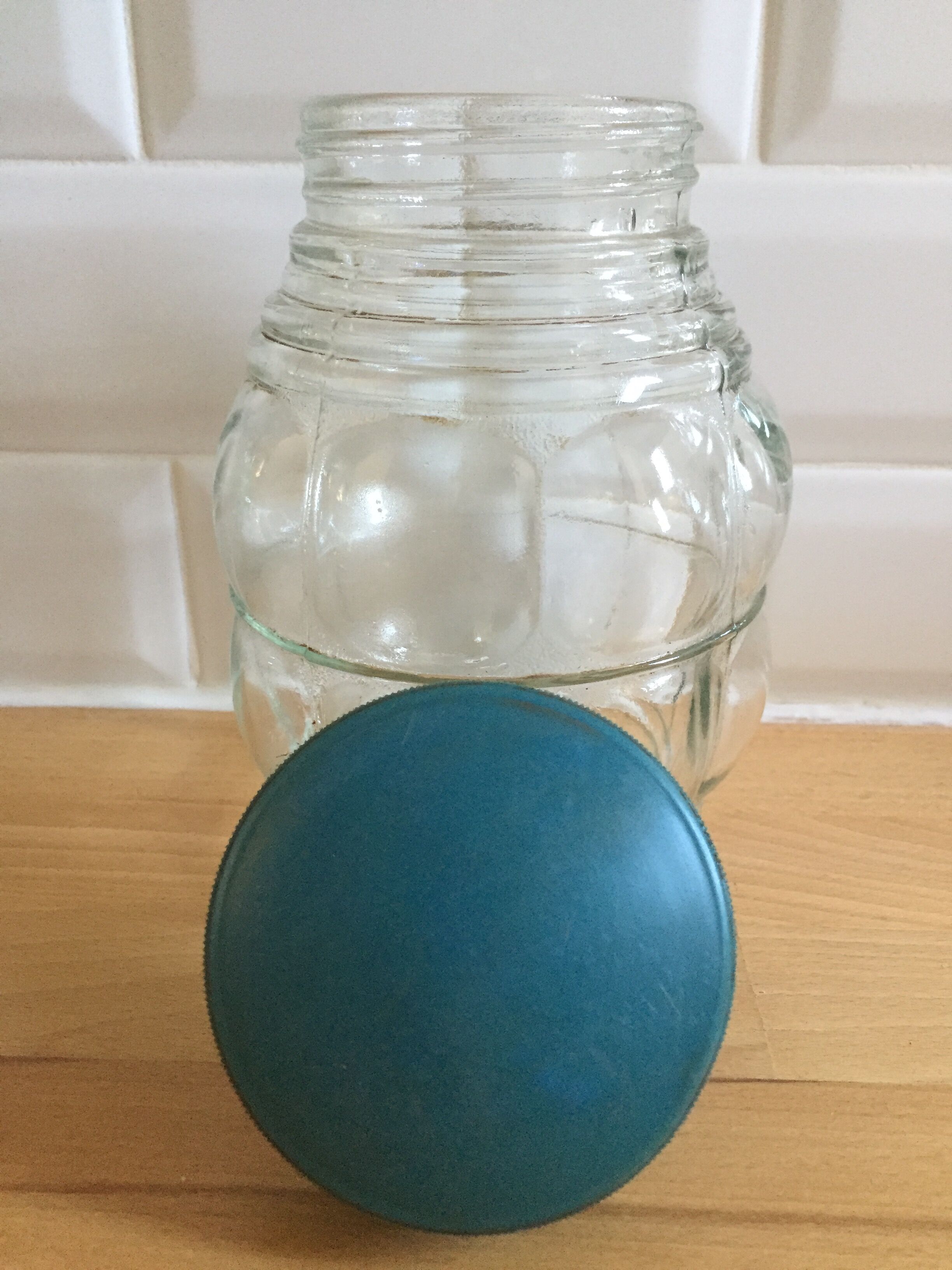 Vintage jar, curved shape with blue cap