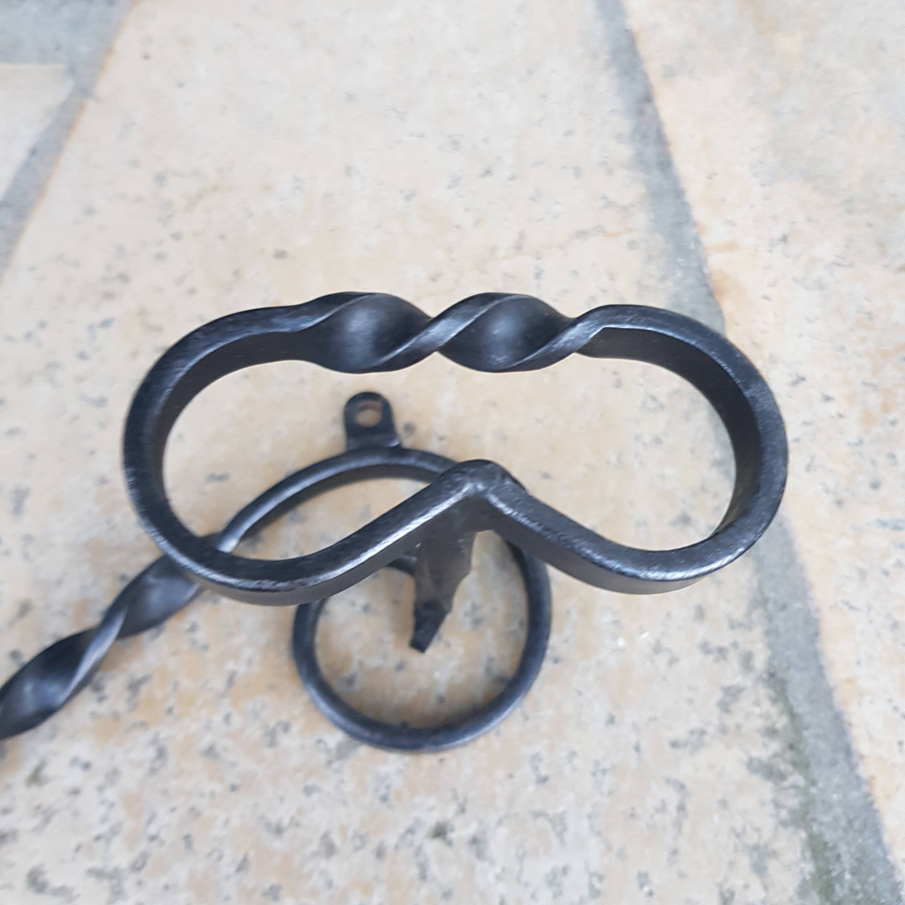Wrought iron wall coat rack