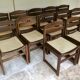 Set of 12 "sledge" dining chairs in walnut and cane.