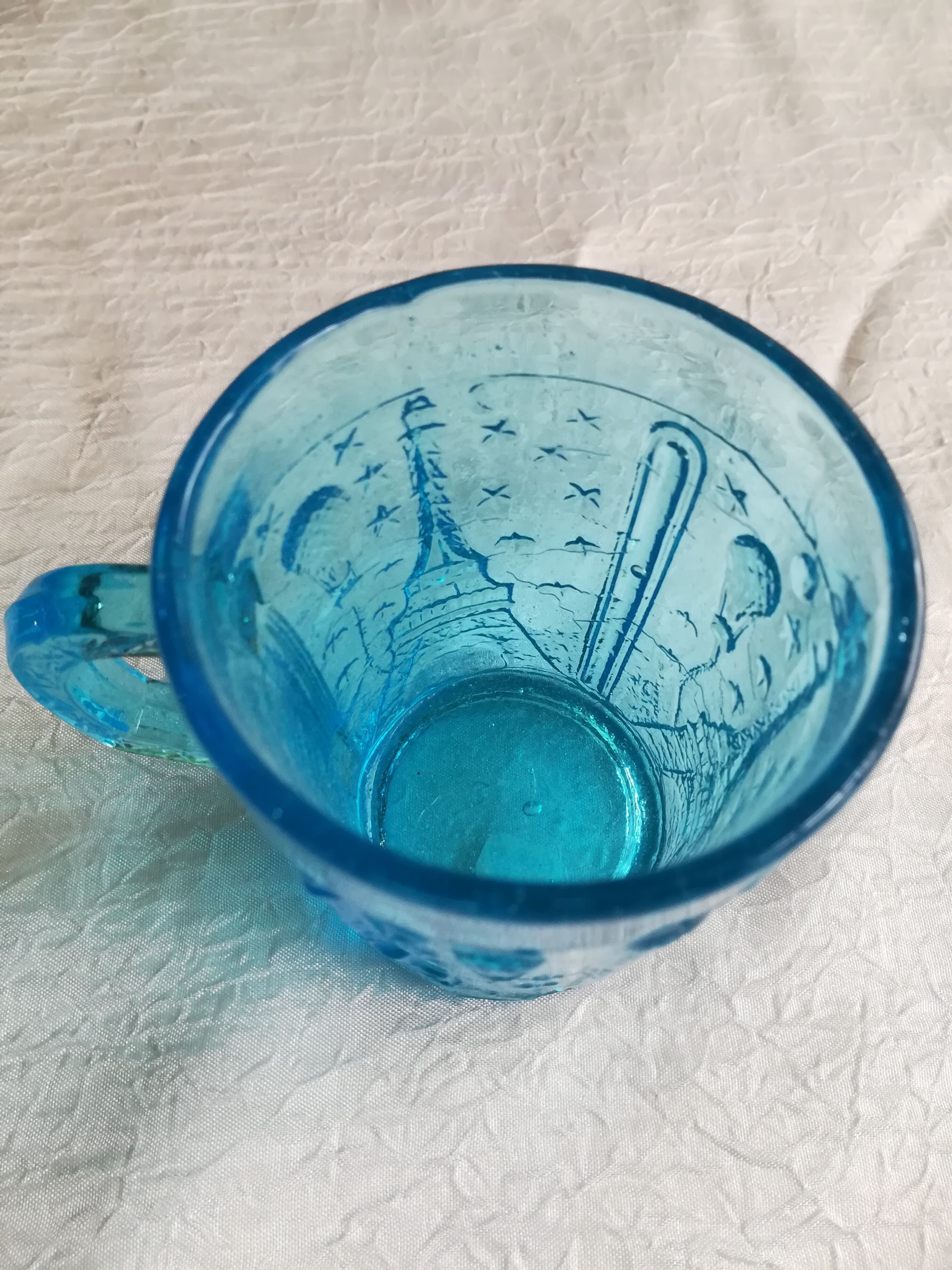 Old turquoise glass cup
