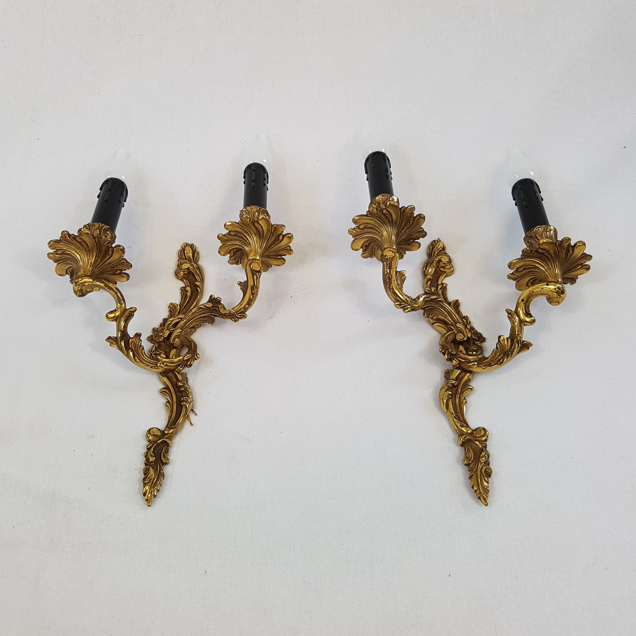 Pair of Louis XV style bronze wall lamps