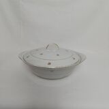 White earthenware soup tureen with a golden pattern.