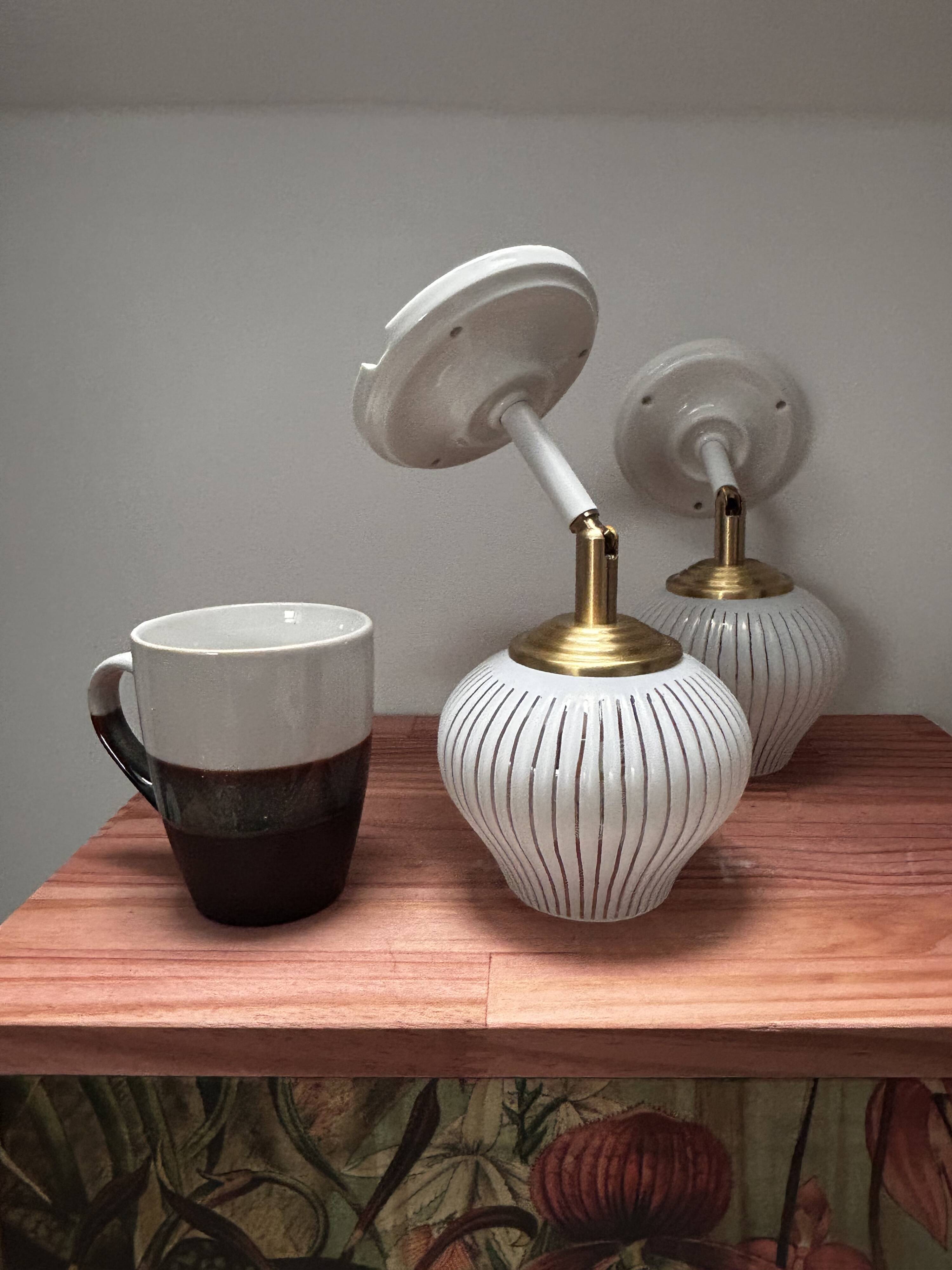 Pair of vintage white globe tilting wall sconces