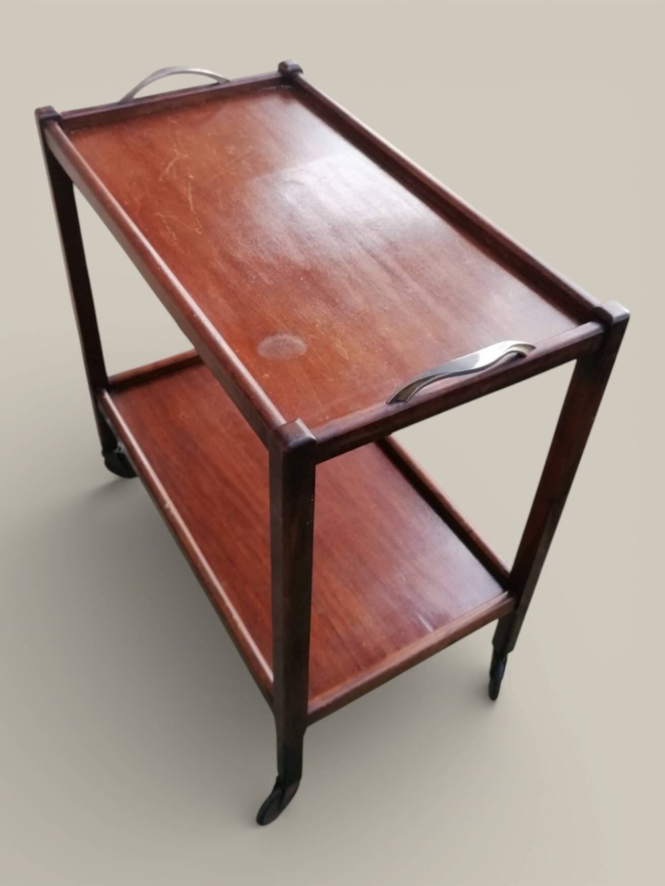 Art Deco wooden serving trolley on wheels.