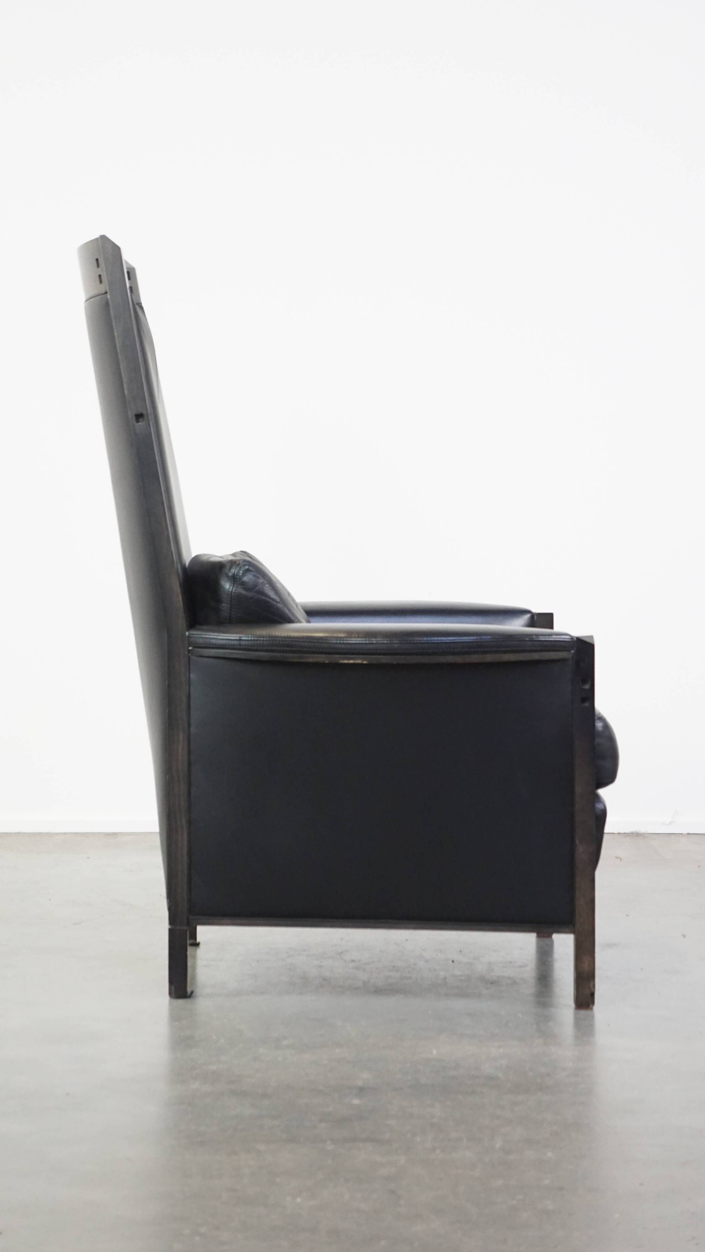 Fauteuil design en cuir noir de Giorgetti