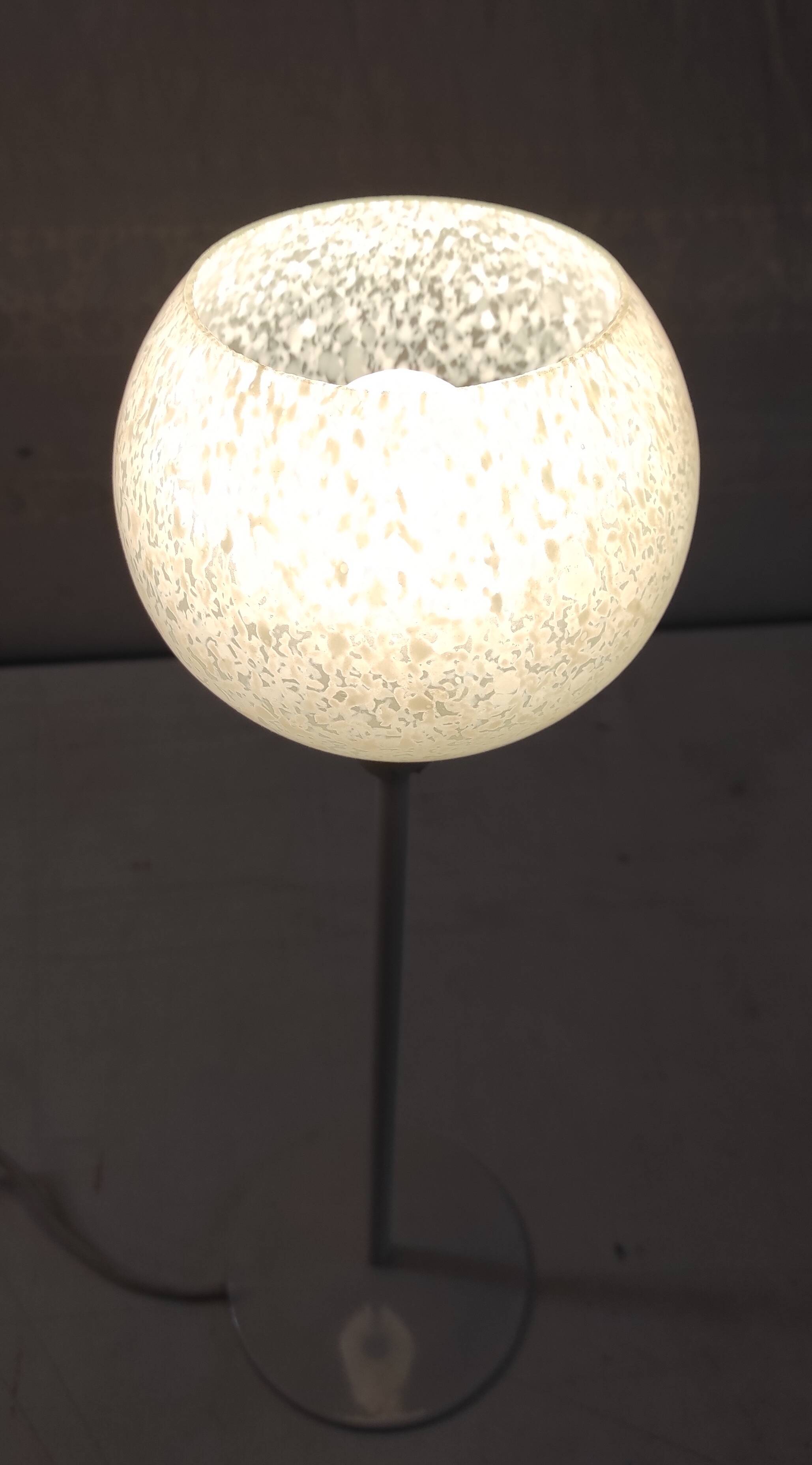 Table lamp with a pale green Clichy glass globe.